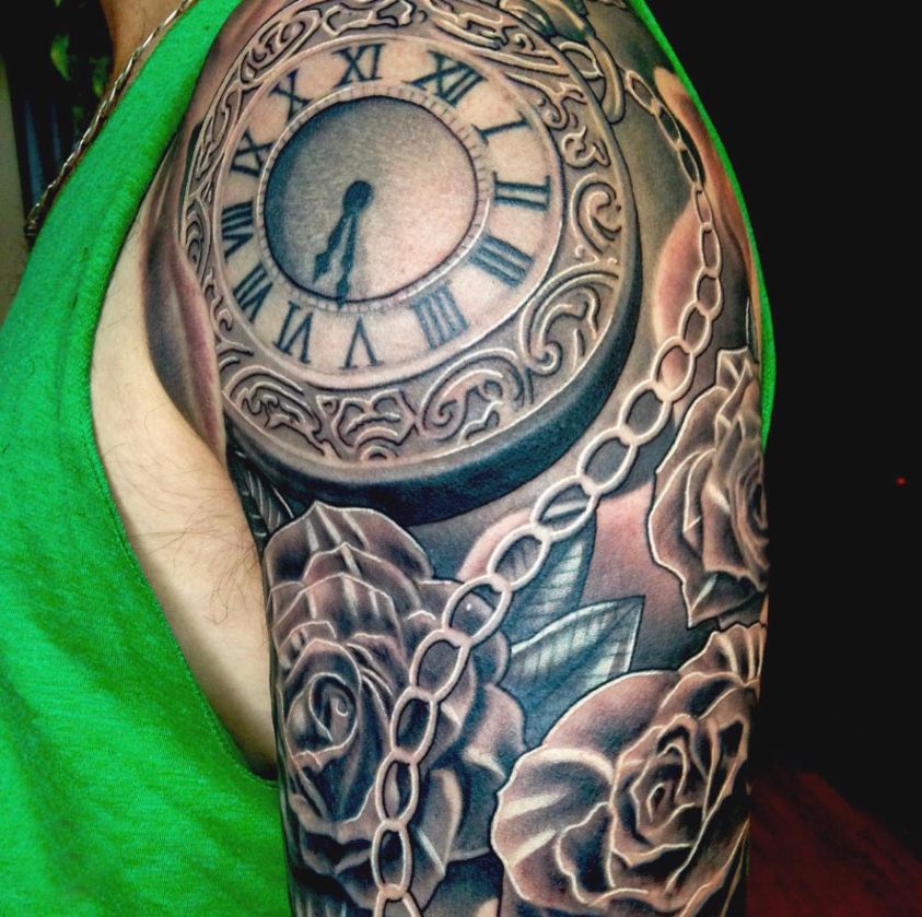 black and grey pocket watch tattoo with chain and roses