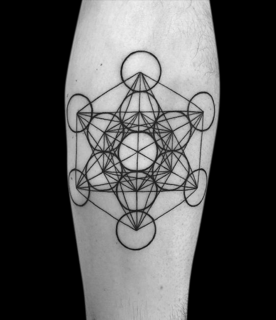 geometric tattoo of a complex design of circles intersecting with triangulated lines tattood on inside forearm