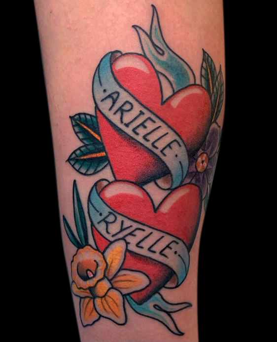 two traditional red hearts with banners including names with a yellow daffodil at the bottom