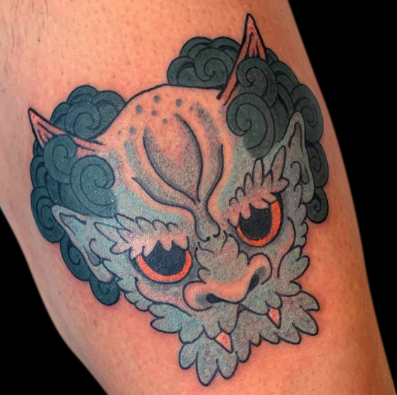 colour fu dog tattoo blue and green with yellow eyes