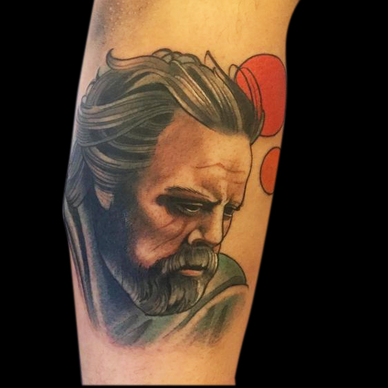 neotraditional colour tattoo of older Luke Skywalker from Star Wars with two red planets behind him