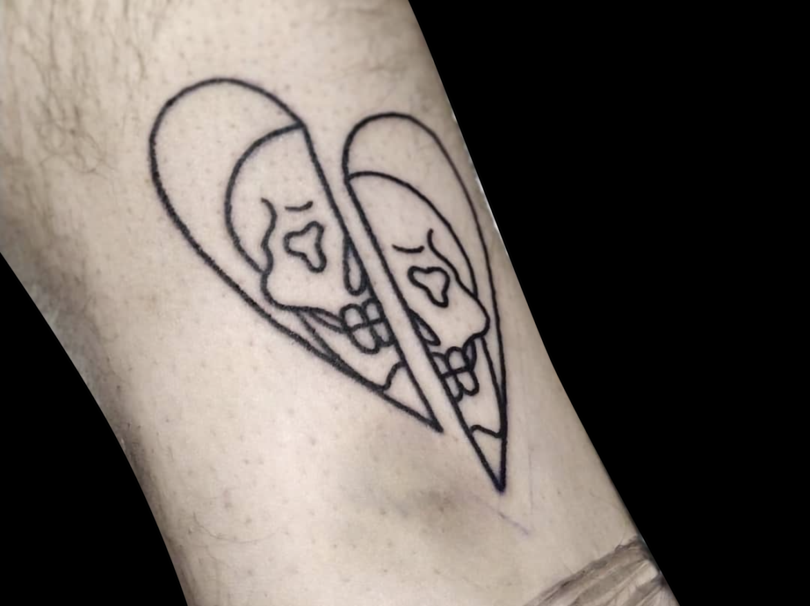 blackwork tattoo flash design of a heart outline split in two with one half of a skull in each part