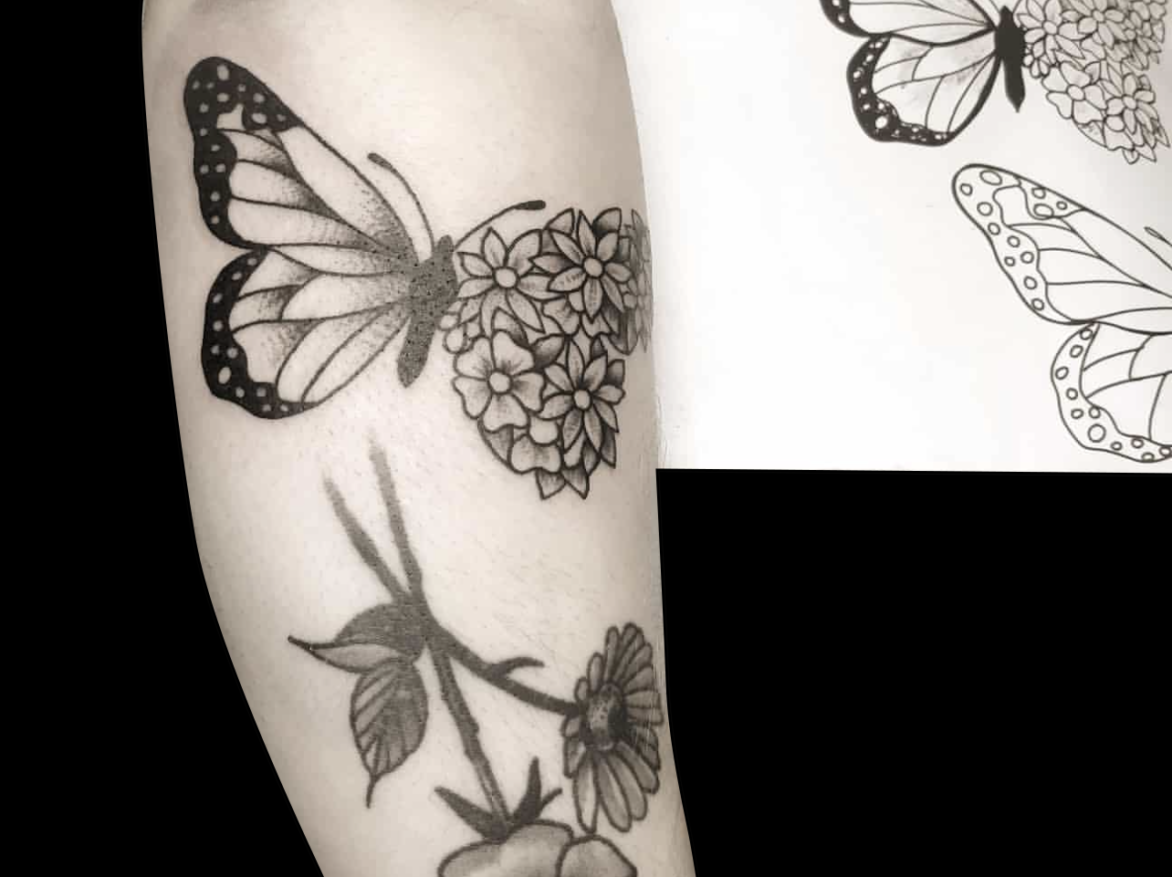 blackwork tattoo of butterfly with one wing normal and the other wing made up of simple flowers