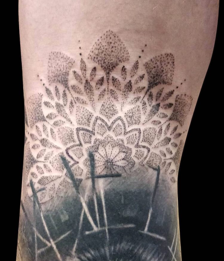 dotwork mandala tattoo on the back of knee