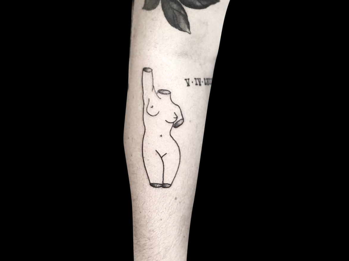 fineline tattoo of a woman sculpture with no head, arms or legs