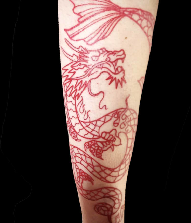 red ink tattoo of a dragon on forearm with tail above its head no shading just linework tattoo