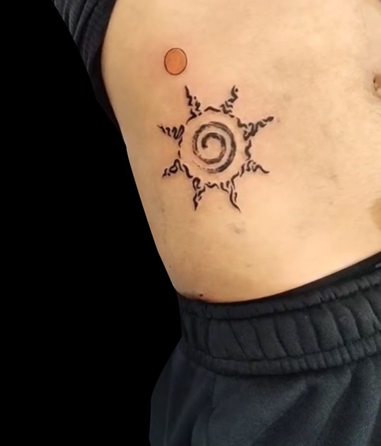 black sprial sun tattoo with yellow moon above it on ribs