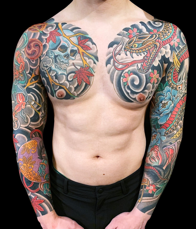 colour japanese tattoo sleeves that come onto to both sides of the chest featuring snake, skull, oni, hanya, flowers and windbards on both arms