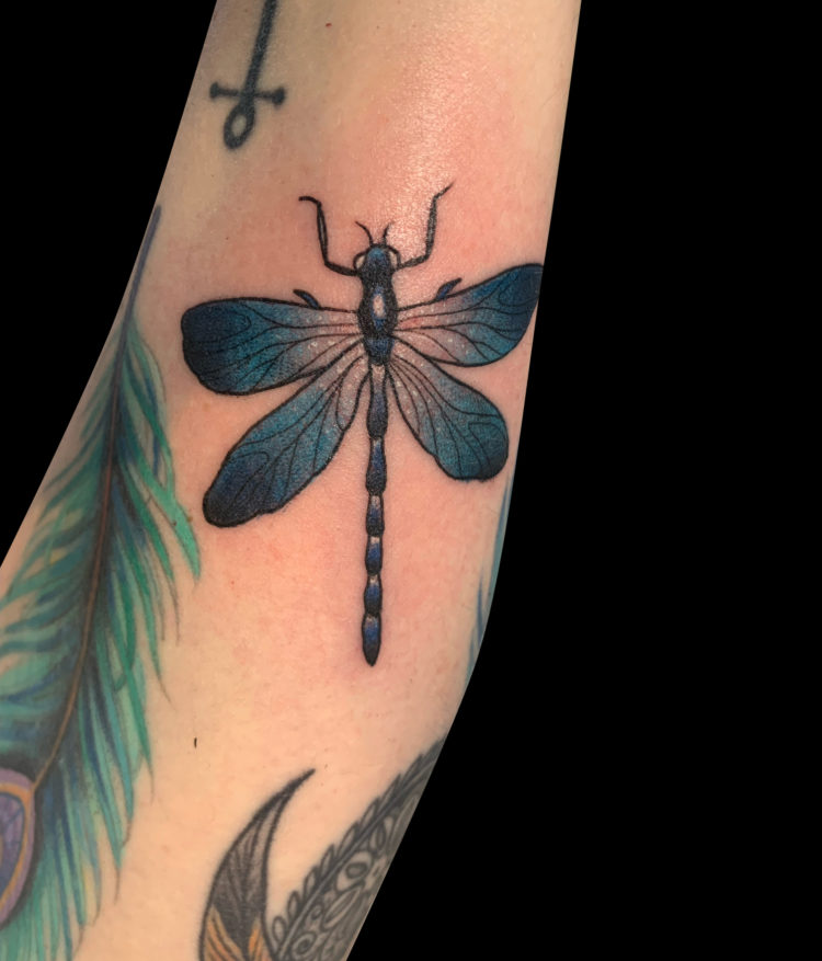 colour tattoo of a blue dragonfly with four glittery wings