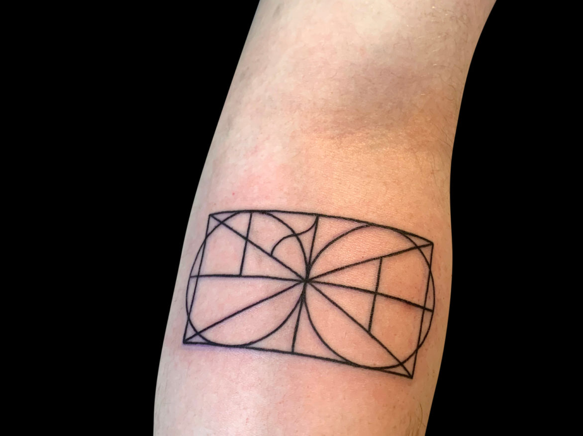 geometric tattoo of rectangle with two circles inside it and triangles inside the circles