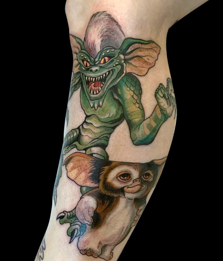 Colour tattoo of Gremlins characters Spike and Gizmo tattooed on leg