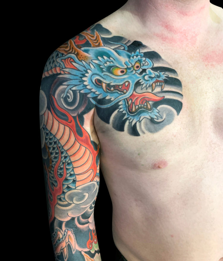 Colour Japanese dragon tattoo sleeve featuring blue dragon, flames and wind bars