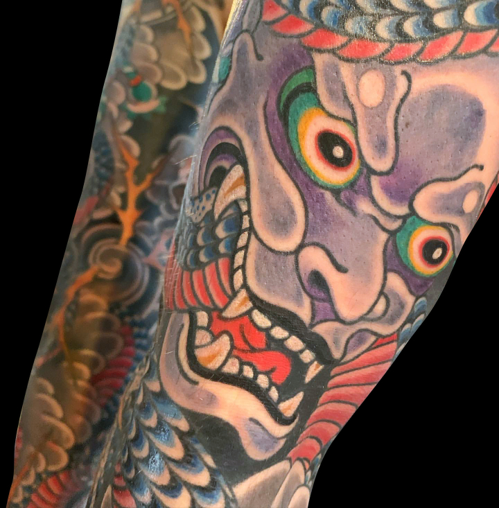 detail of Japanese tattoo sleeve purple hanya mask tattoo