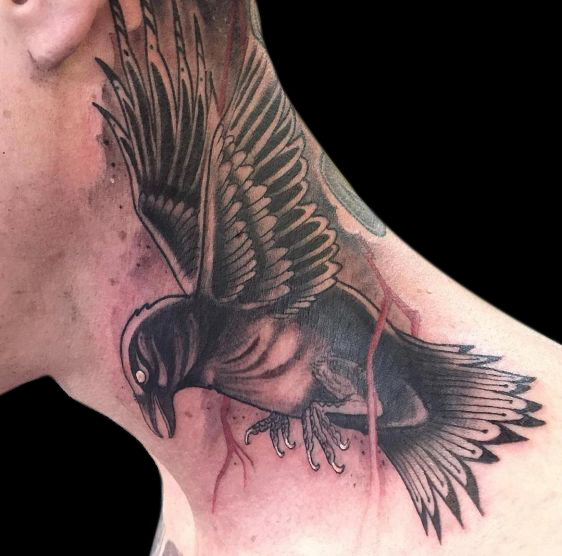 black and grey tattoo of flying raven on neck with red lightening bolts and white eye