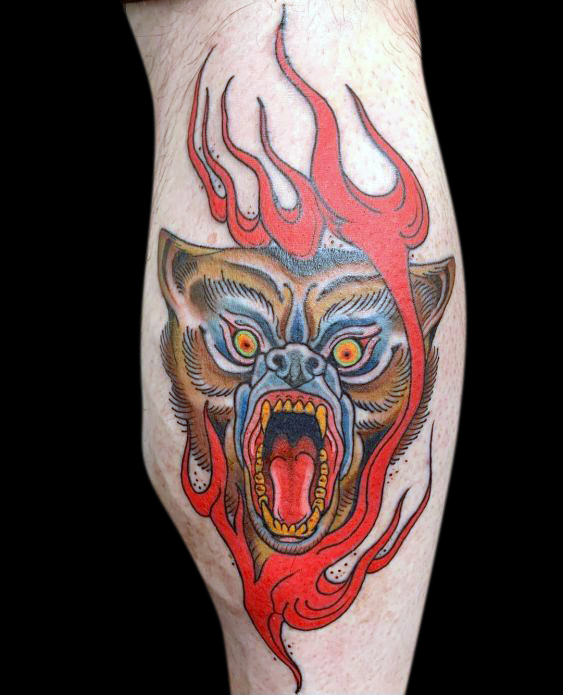 colour tattoo of a stylized snarling bear with red flames